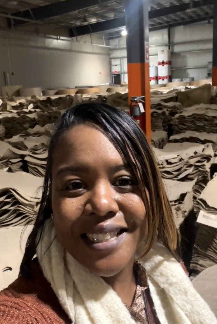 Vanessa touring a molded fiber production floor